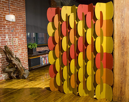 MIO Nomad system in orange, yellow and red, used in a loft
